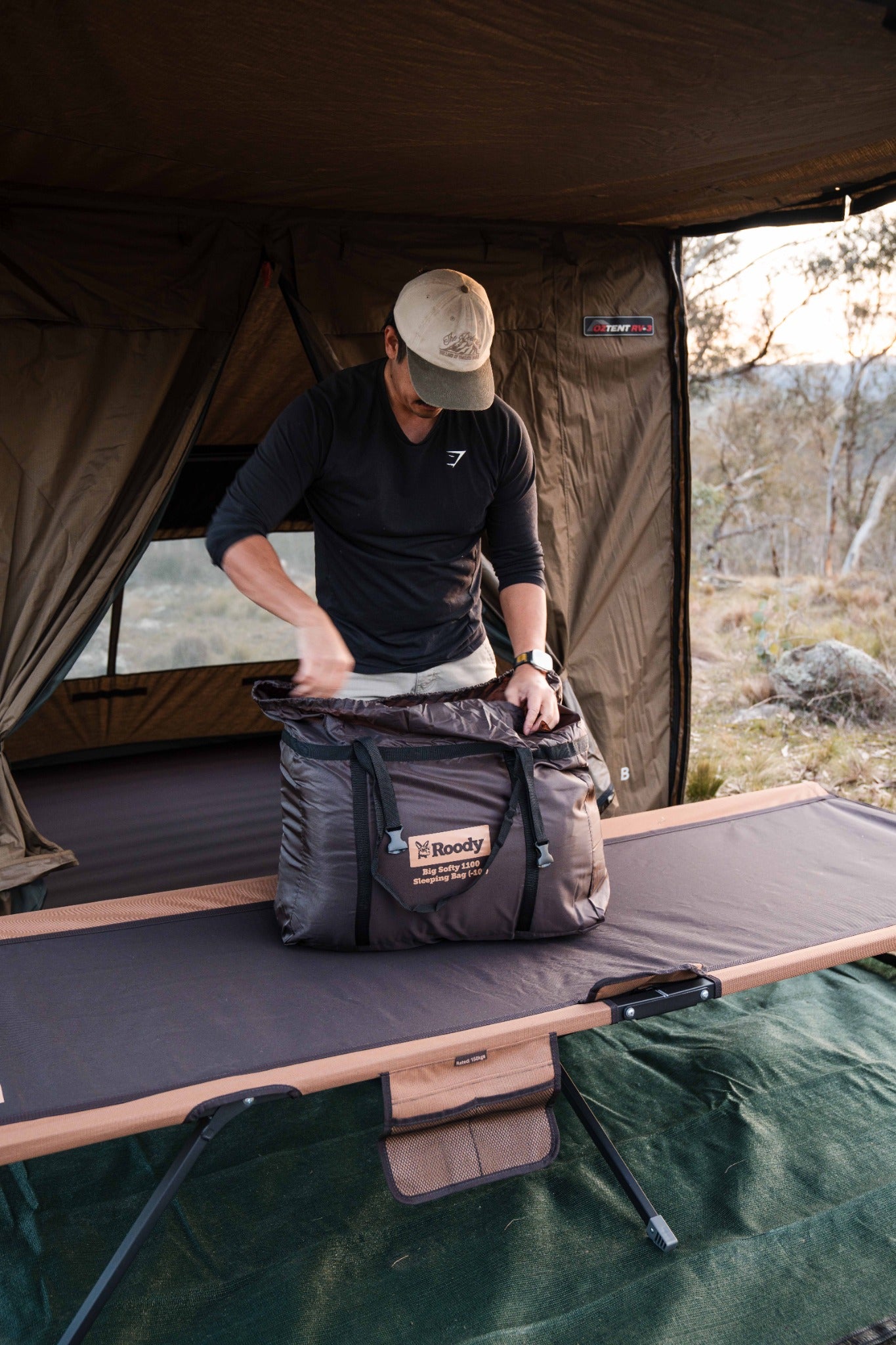 Packing a Roody sleeping bag at camp